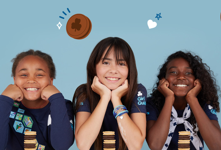 Three young Girl Guides smiling